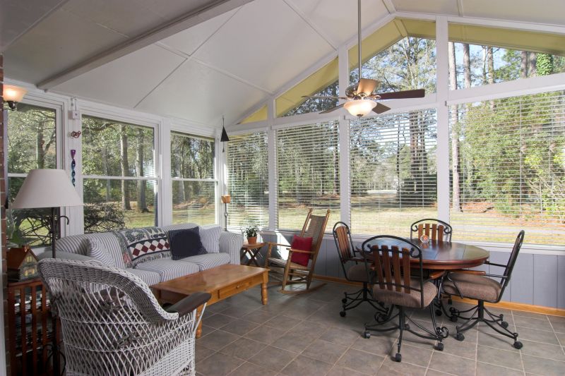 Cozy Sunroom with Seating Area